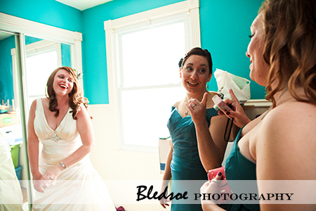 "Bride laughing with her bridesmaids"