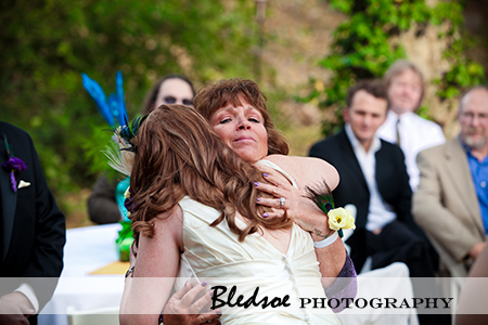 "Brides hugs her mother"