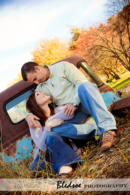 "Amy and Scott cuddle in the back of a vintage truck at UT Gardens"