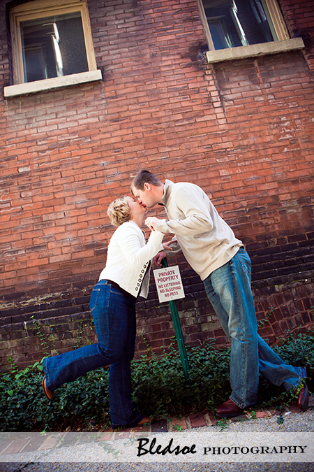 "Kissing in front of a No Loitering sign"