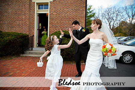 "Bride gives high five to her flower girl"