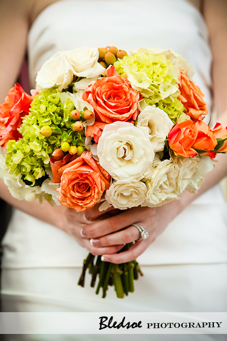 "Bridal bouquet of white roses, orange roses, green hydrangea"