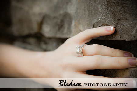 "Engagement Ring against stone wall"